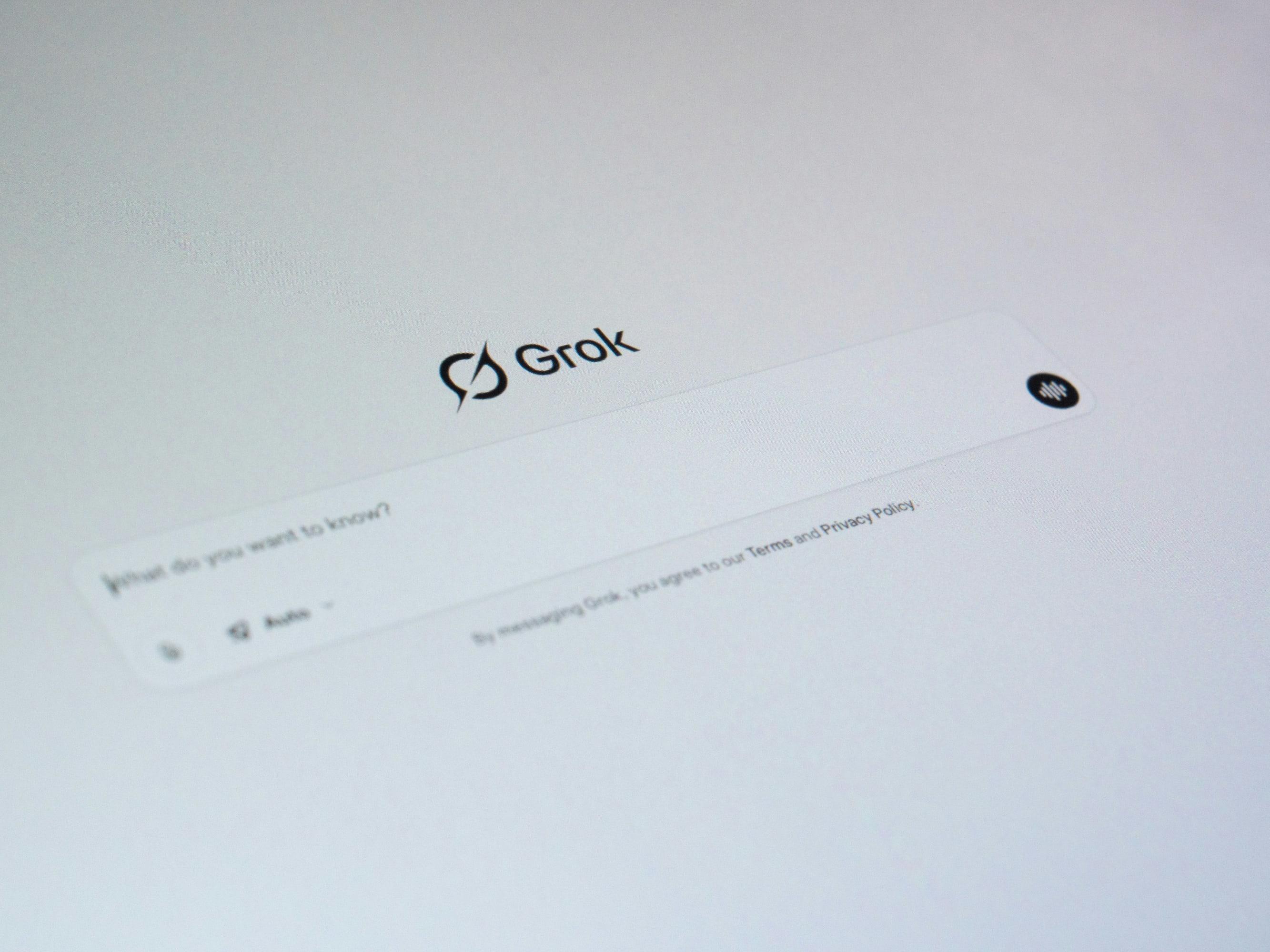 Grok's chat interface open on a laptop screen, shown at an angle